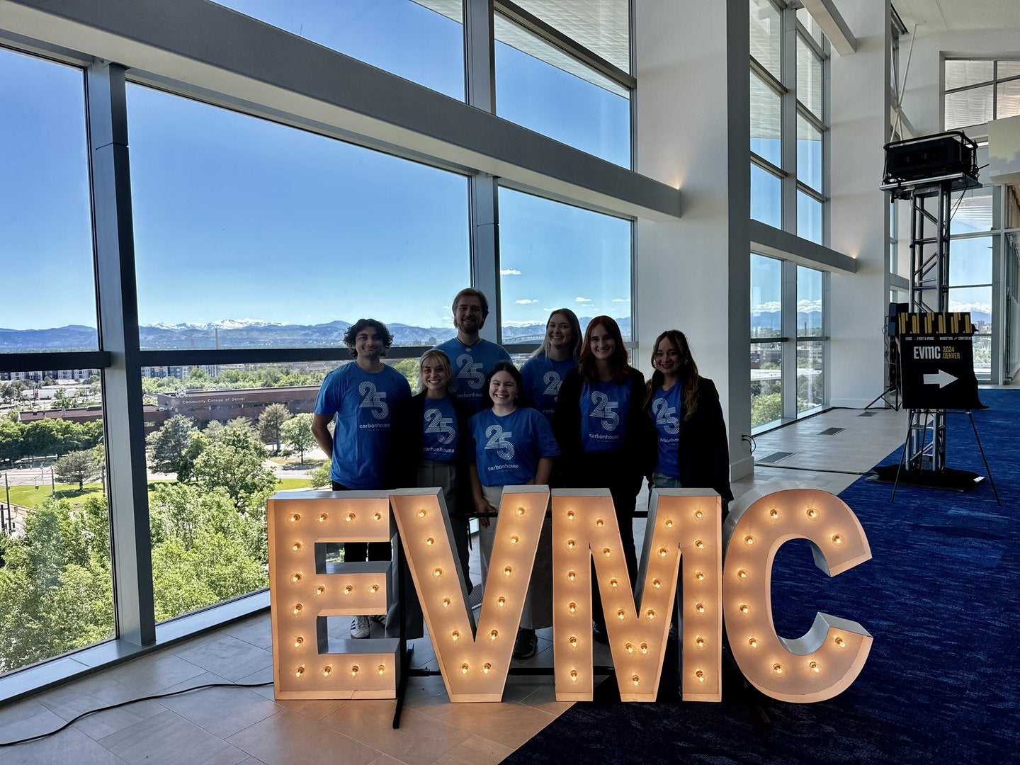 The 2024 EVMC interns posing with the EVMC sign.